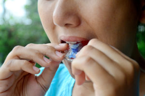 Woman putting in retainer
