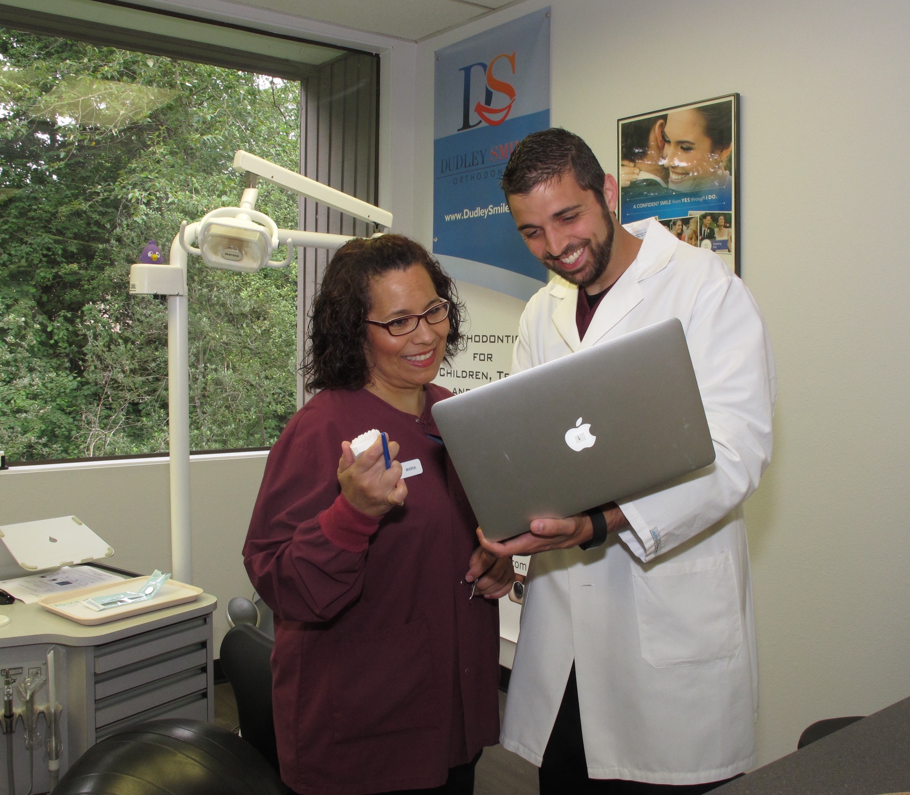 Dr. Dudley talking with a staff member