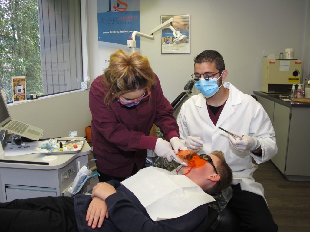 Dr. Dudley working with a patient