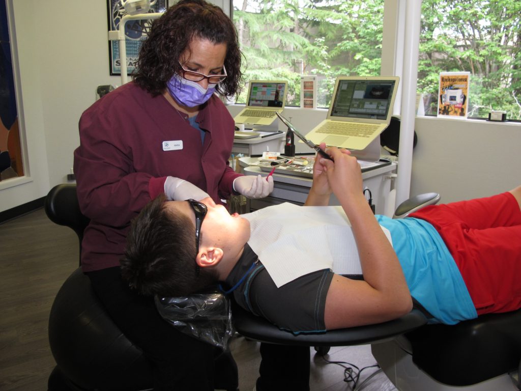 Dudley Smiles staff working with a patient